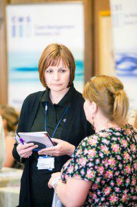 Staff member Vivien Green discusses the See Hear project at an information event