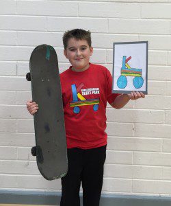 Photo caption: Aaron Baty of Kirkcudbright Primary school (p6) has won the logo competition for Kirkcudbright Skatepark. Aaron's logo will be used on publicity materials, t-shirts and corporate funding packs in a bid for Kirkcudbright to have its own skatepark