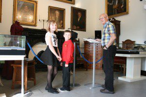 Kristina and Alfie Stewart-Kay and Alan Kay visiting the Annan Museum permanent exhibition 