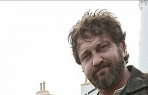 Gerard Butler with the Mull of Galloway Lighthouse behind him.