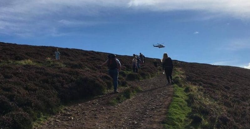 INJURED WOMAN WINCHED OFF TINTO BY HELICOPTER