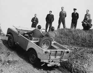   Testing the Land Rover in suits. 