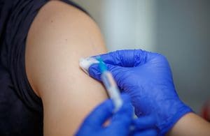 Testing and vaccination call as case numbers rise ahead of Omicron arrival 