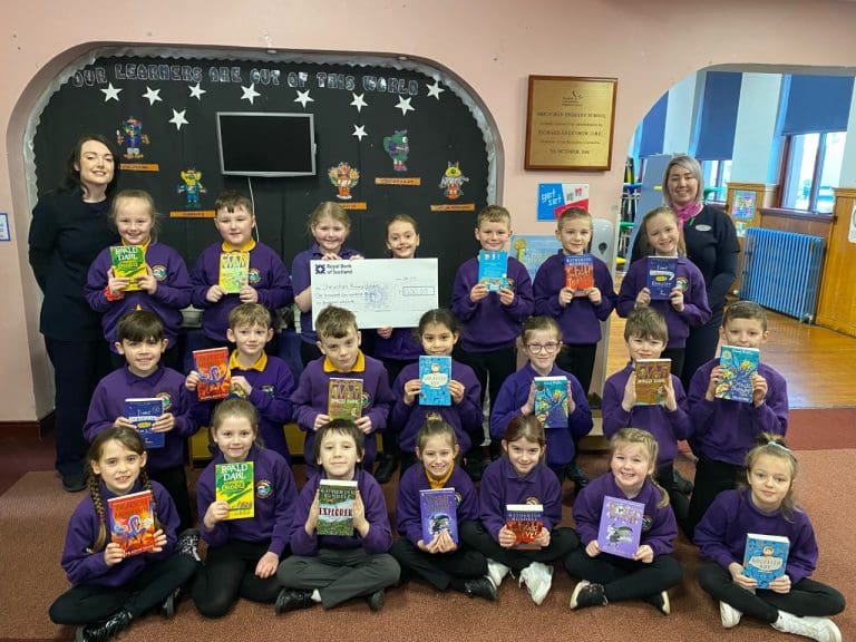 Stranraer opticians raises £1,100 to buy books for local schoolchildren