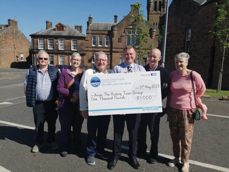 Annan The History Town Group Receives £1,000 Cheque for Summer Festival from Cunninghame Housing Association