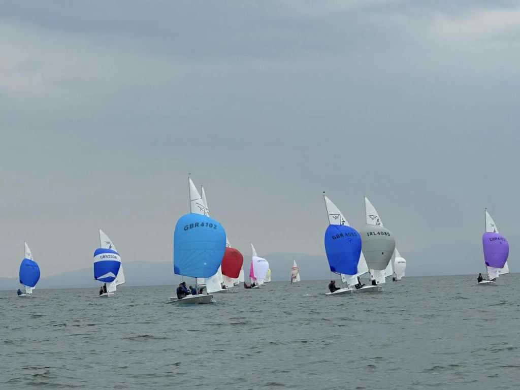 Spinnakers flying, the fleet heading downwind in race 2 (Photo: Anne-Marie Williams)
