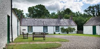 A Farm in Dumfries and Galloway where poet Robert Burns wrote Auld Lang Syne has been awarded accredited museum status after an intensive three-year drive to improve the care of its collection.