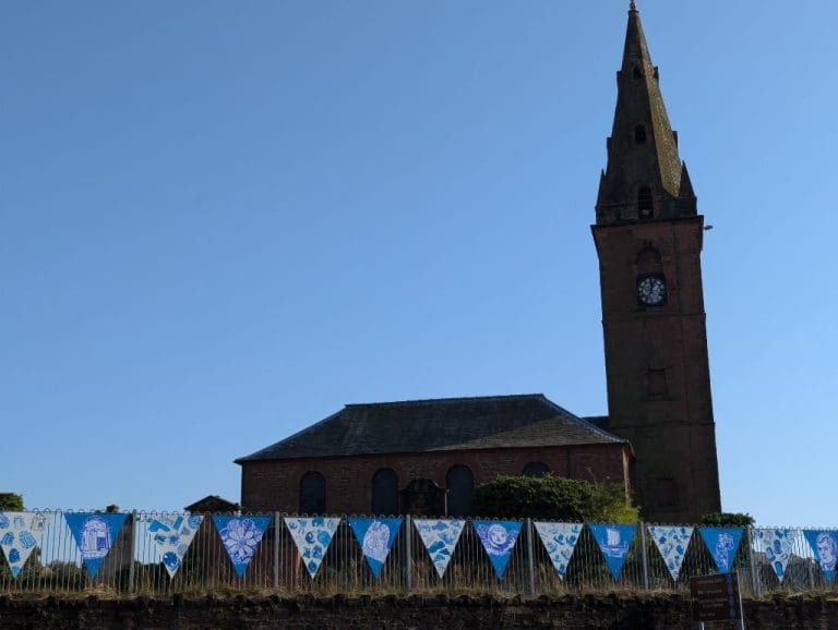 AccessArt Turns St. Michael’s Church into a Creative Canvas with Big Blue Bunting Installation