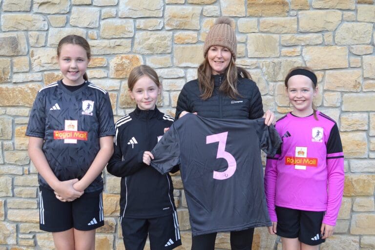 LANGHOLM GIRLS CELEBRATE AS ROYAL MAIL FUNDS NEW KIT